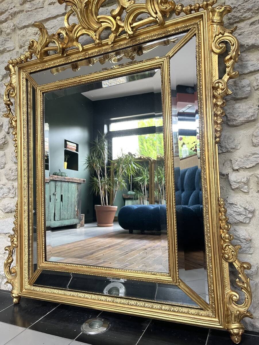 Antique mirror with a frame 123/100cm with gilded pediments, eagle heads, antique.