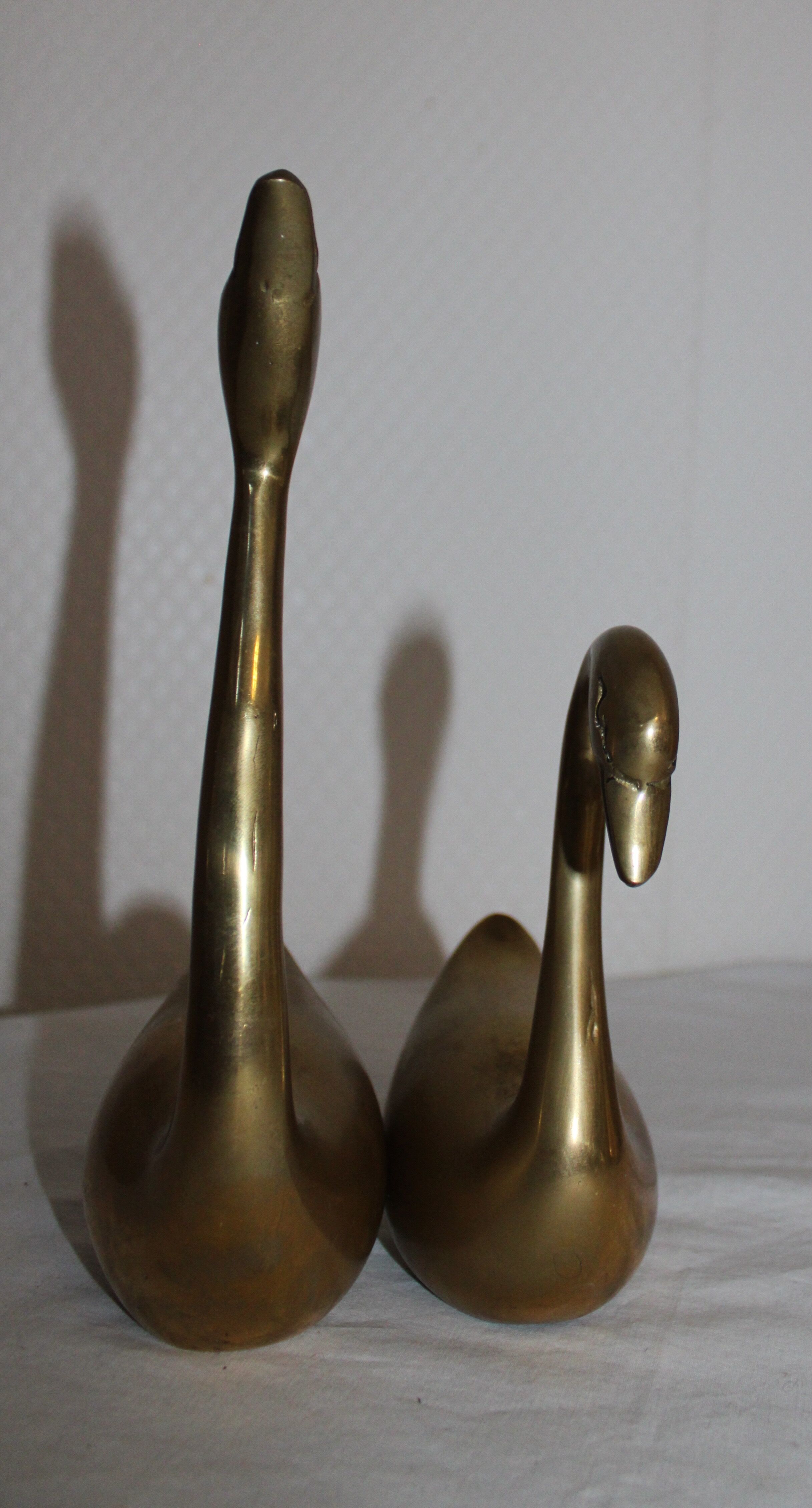 Couple of swans in vintage brass