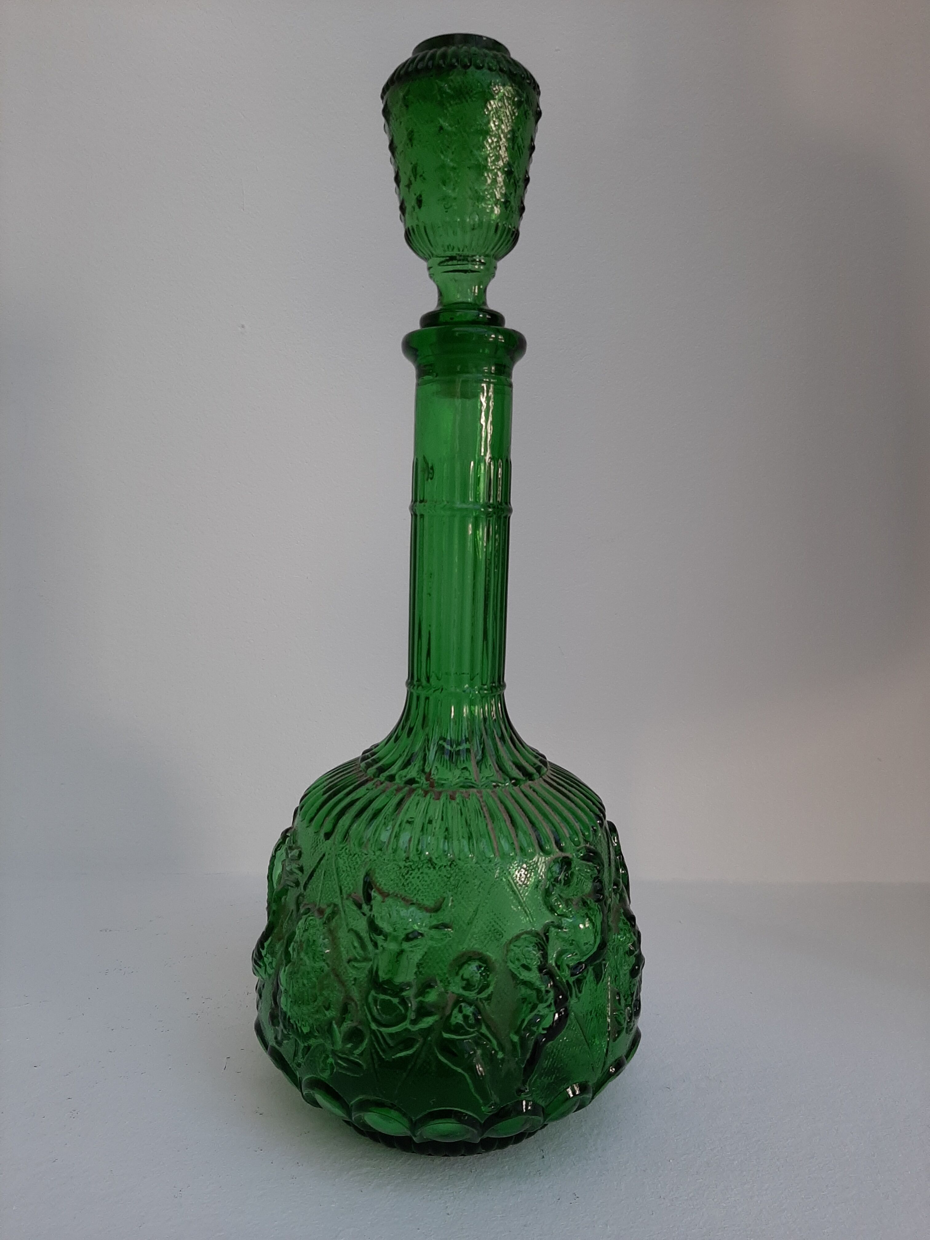 Empoli green glass bottle, zodiac signs