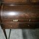 Cylinder desk in mahogany and mahogany veneer, Louis XVI style, 19th century.