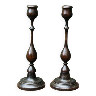 Pair of turned wooden candlesticks