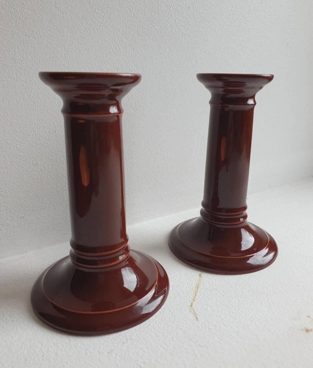 Pair of English brown ceramic candlesticks. Circa 2003, designed by S.