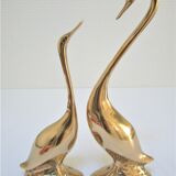 Pair of stylized birds in solid brass