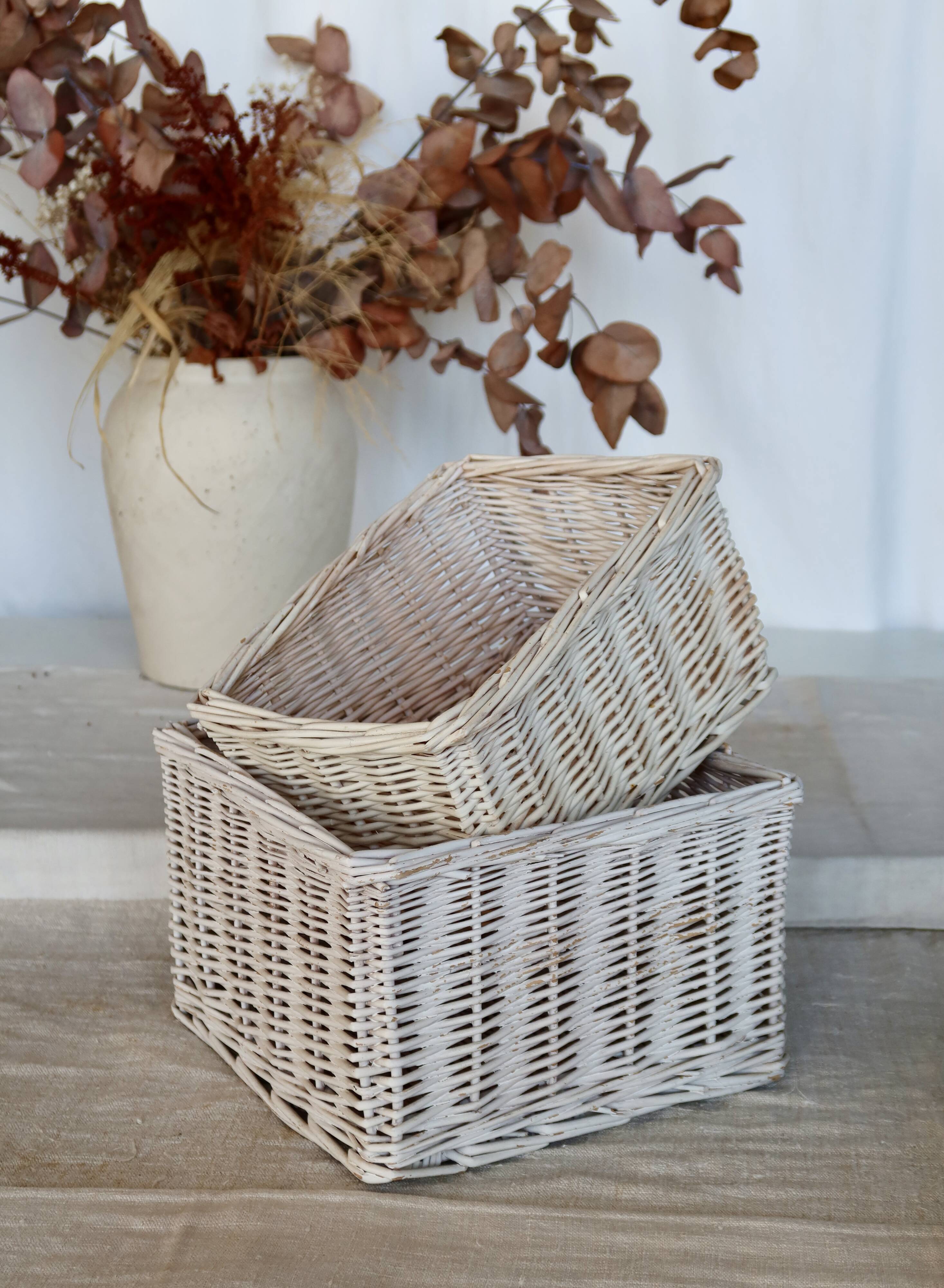 Vintage white wicker storage baskets