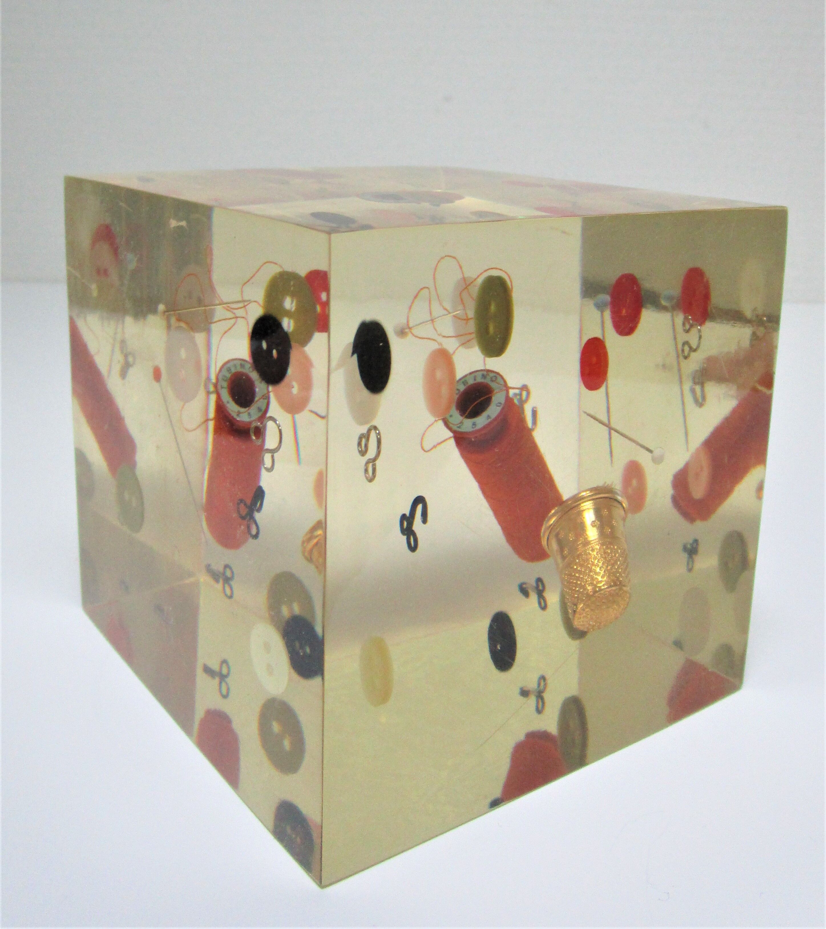 Paperweight sculpture block resin inclusions sewing design 70s