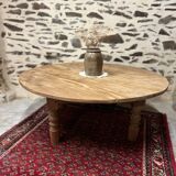 Oval coffee table in raw wood