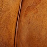 Comfortable, cozy armchair made of sheepskin leather with a proper finish with decorative nailheads