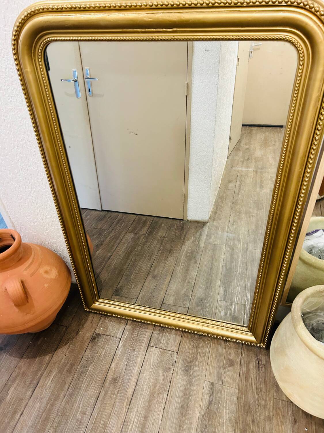 Antique gilded mirror in old Louis Philippe wood