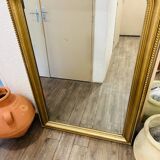 Antique gilded mirror in old Louis Philippe wood