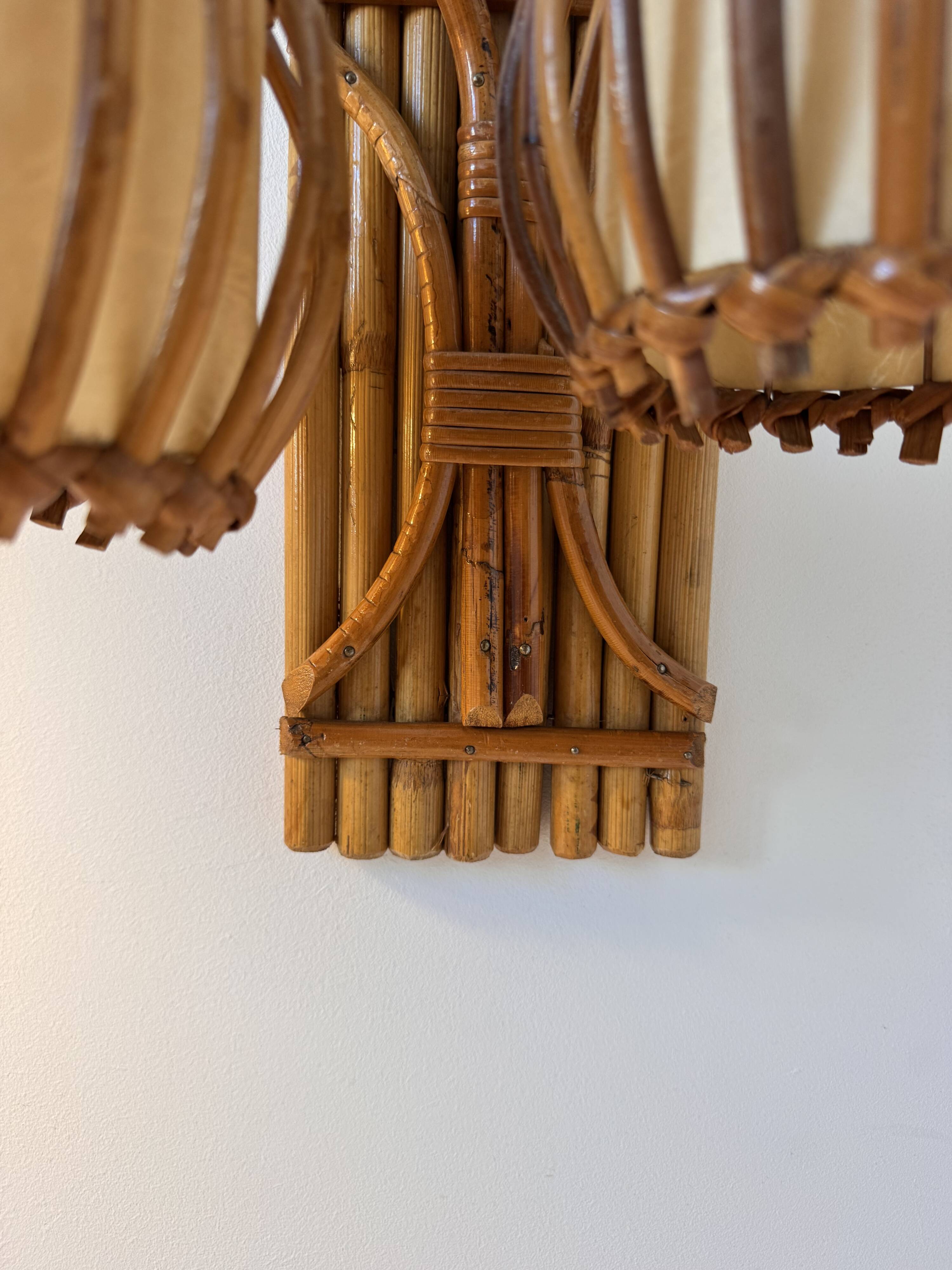 Vintage pair of rattan wall lights, France, 1950.