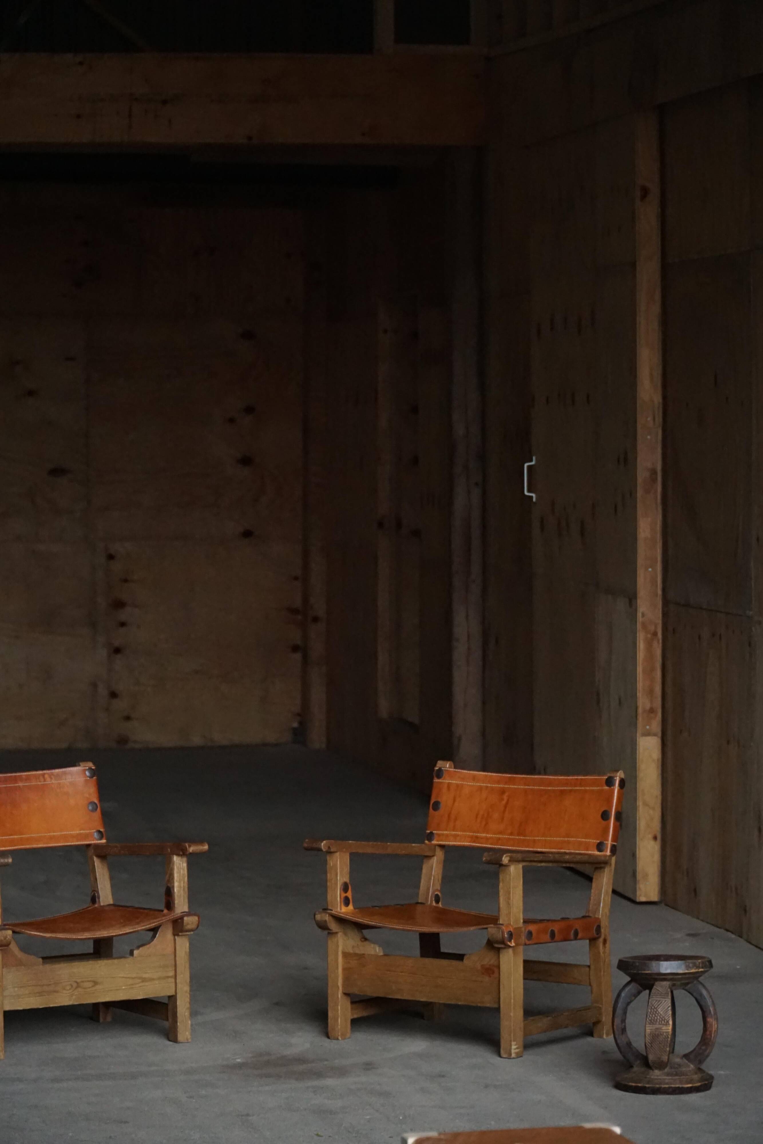 Pair of Spanish brutalist armchairs from the 1960s, wood and leather.
