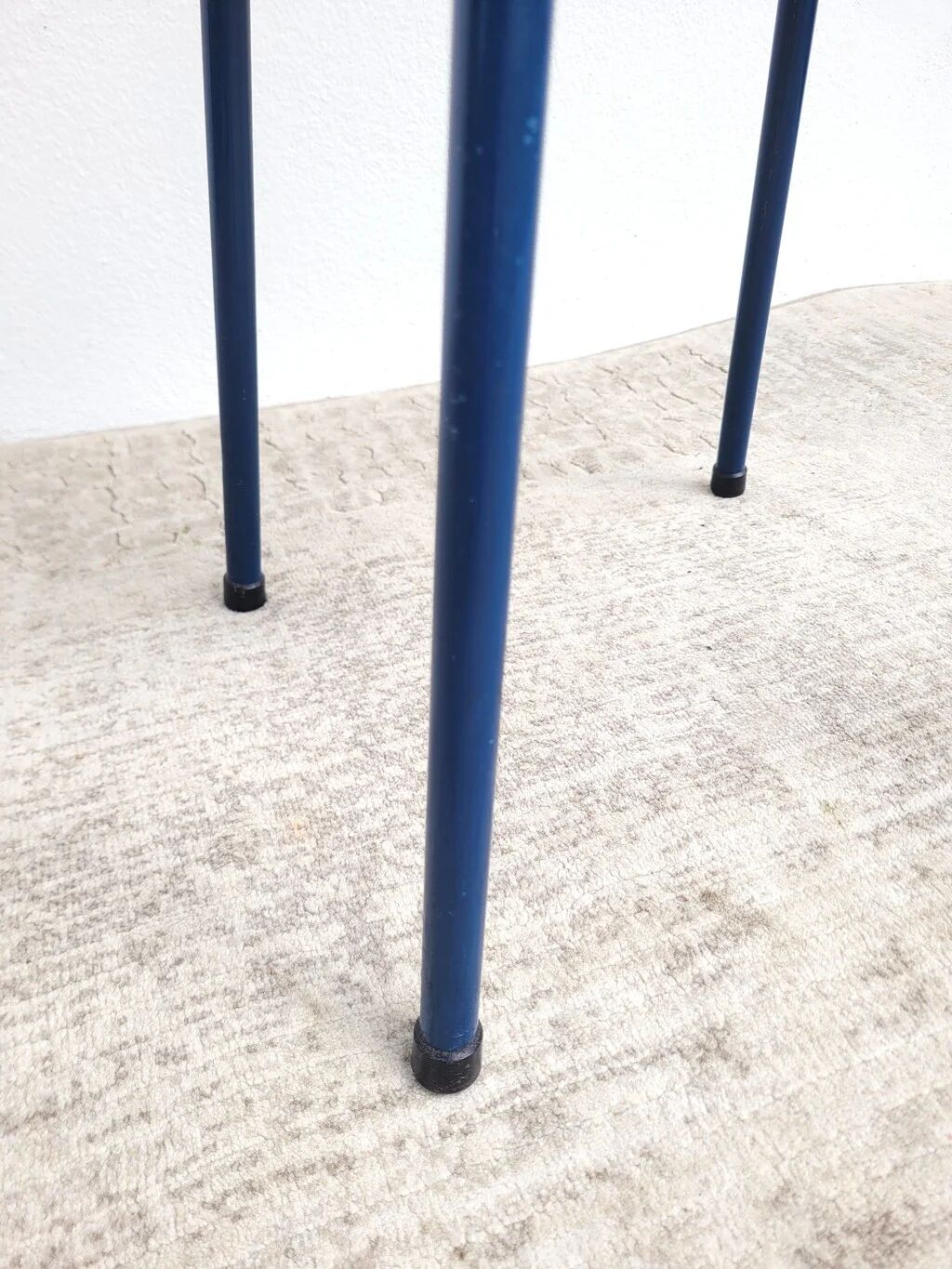 Vintage 80s melamine stool in navy blue checkered pattern.