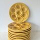 Lot of 12 shell-shaped plates, Barbotine, 1950s.