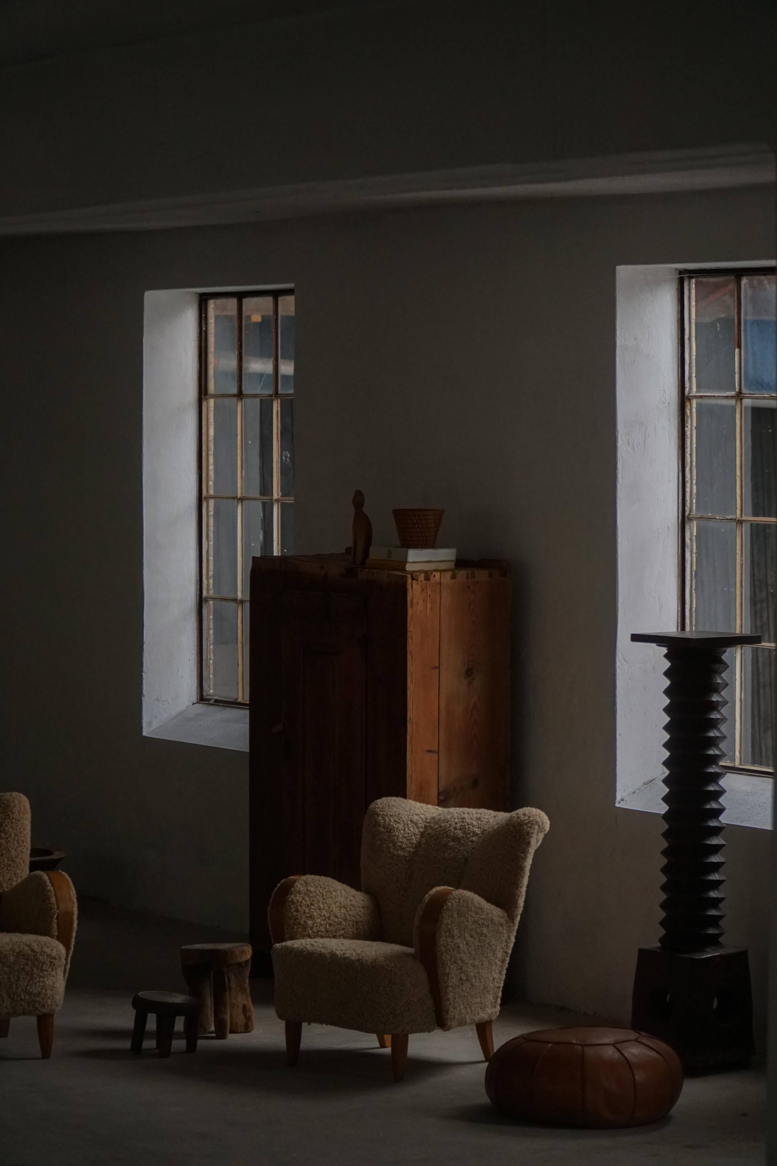 Pair of Danish Art Deco modern lounge chairs in sheepskin with lambswool and elm, 1940s.