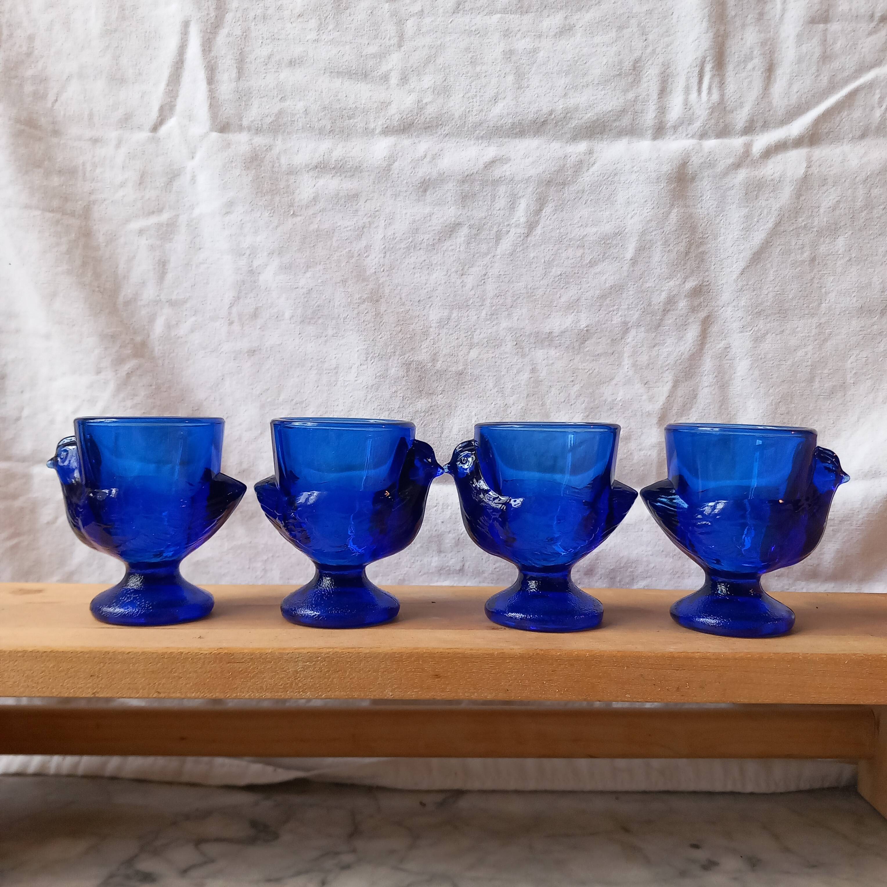 4 chicken-shaped egg cups in cobalt blue glass