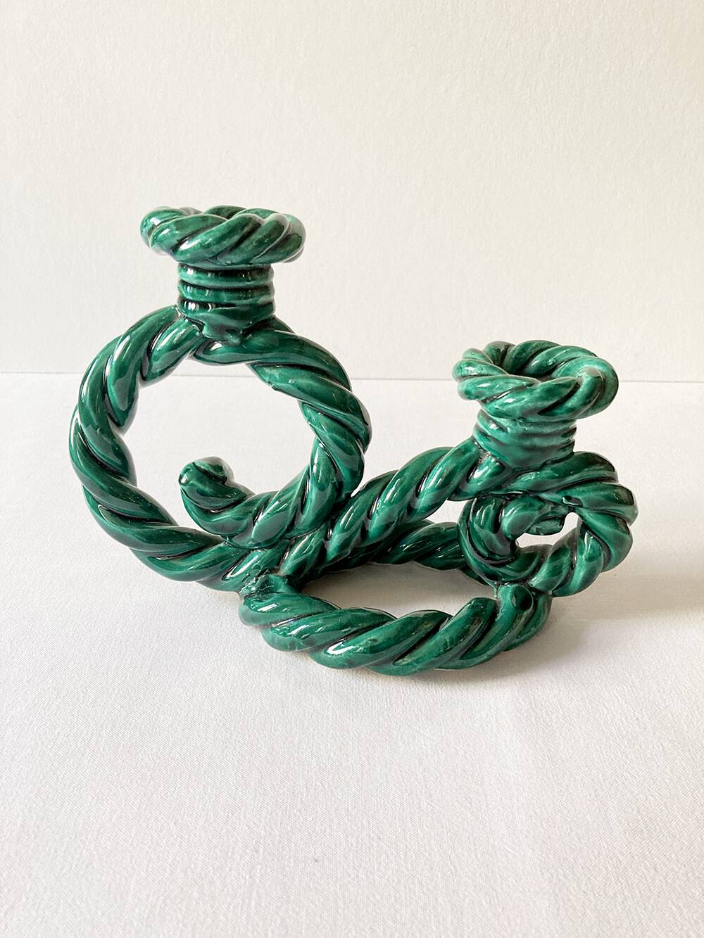 Two-armed candlestick in green glazed ceramic, braided effect