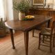 Vintage antique oak table with ornate legs.