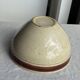 Large speckled beige salad bowl with ochre trim H14 D25