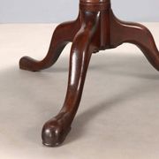 Small antique walnut table with a round top, United Kingdom, 19th century.
