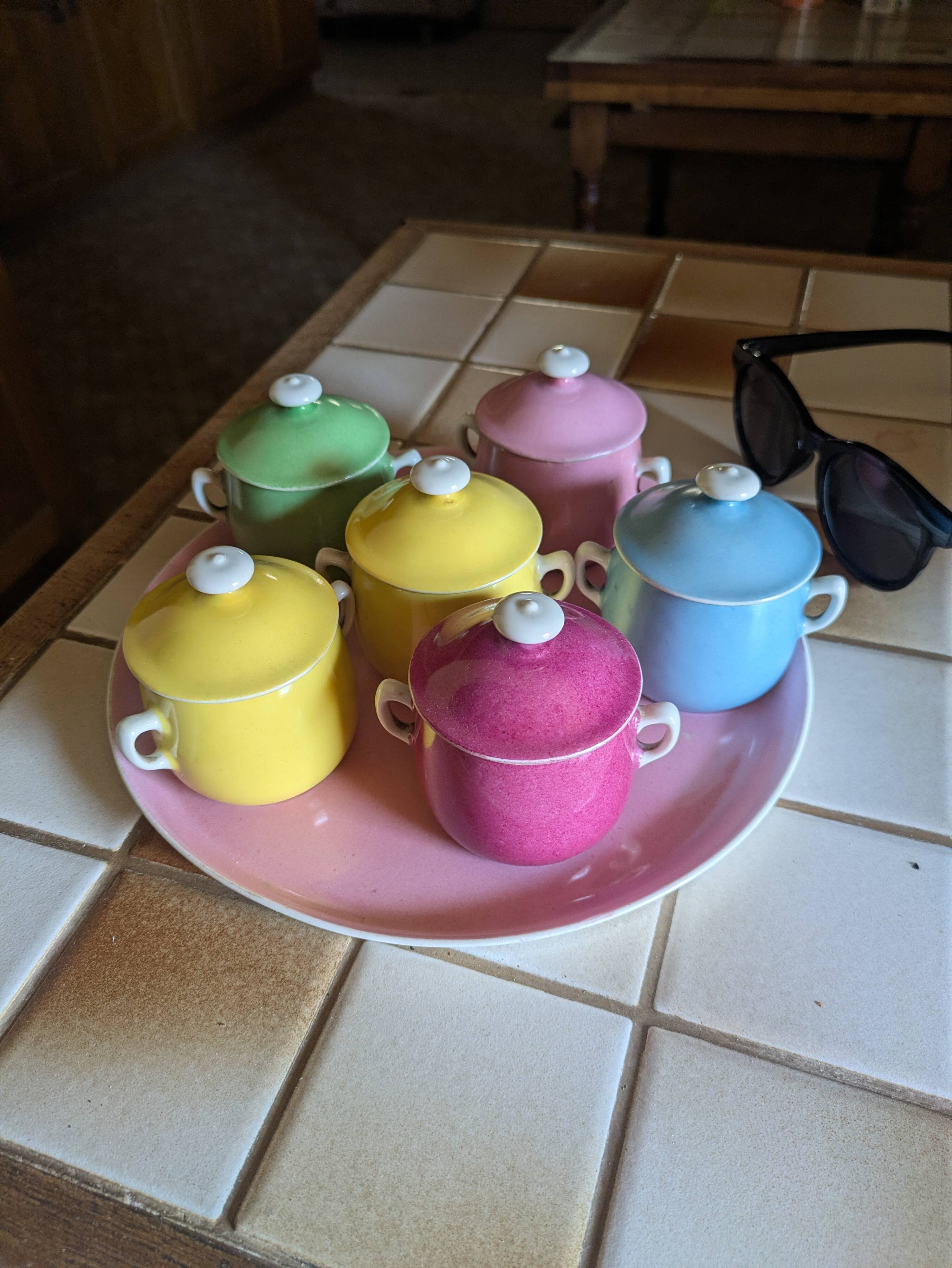 6 small porcelain cream pots from Limoges with a tray.