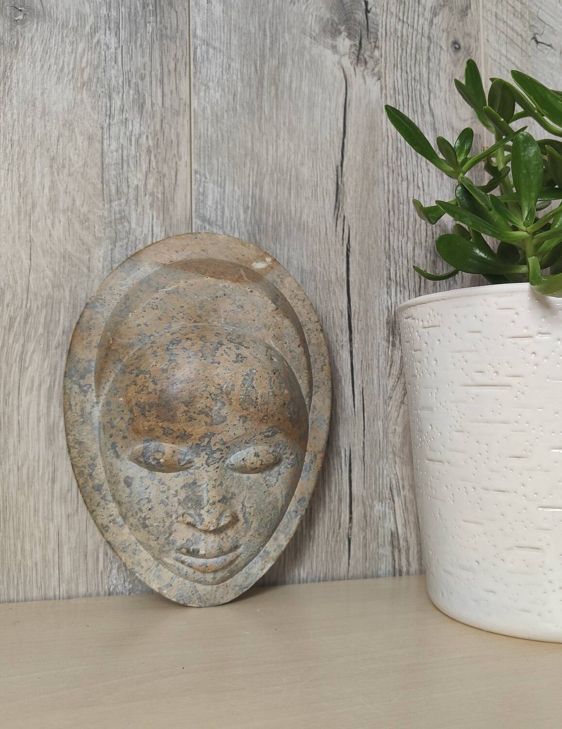 African stone face sculpture