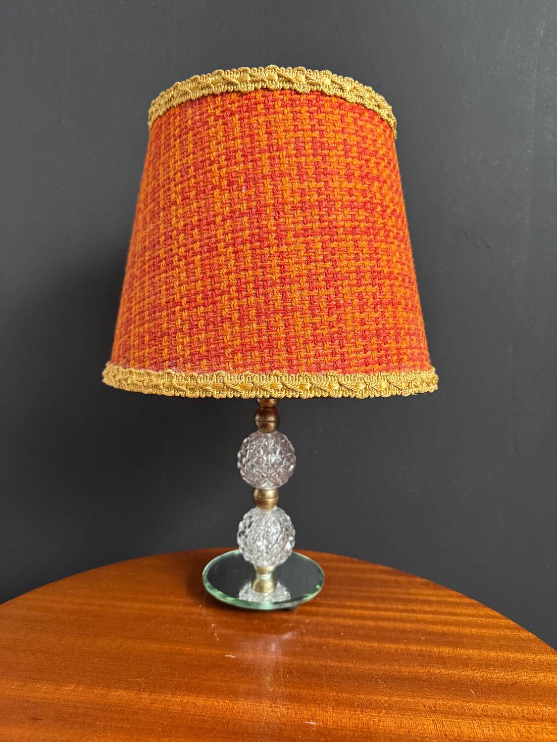 Small glass, mirror, and brass lamp from the 1960s.