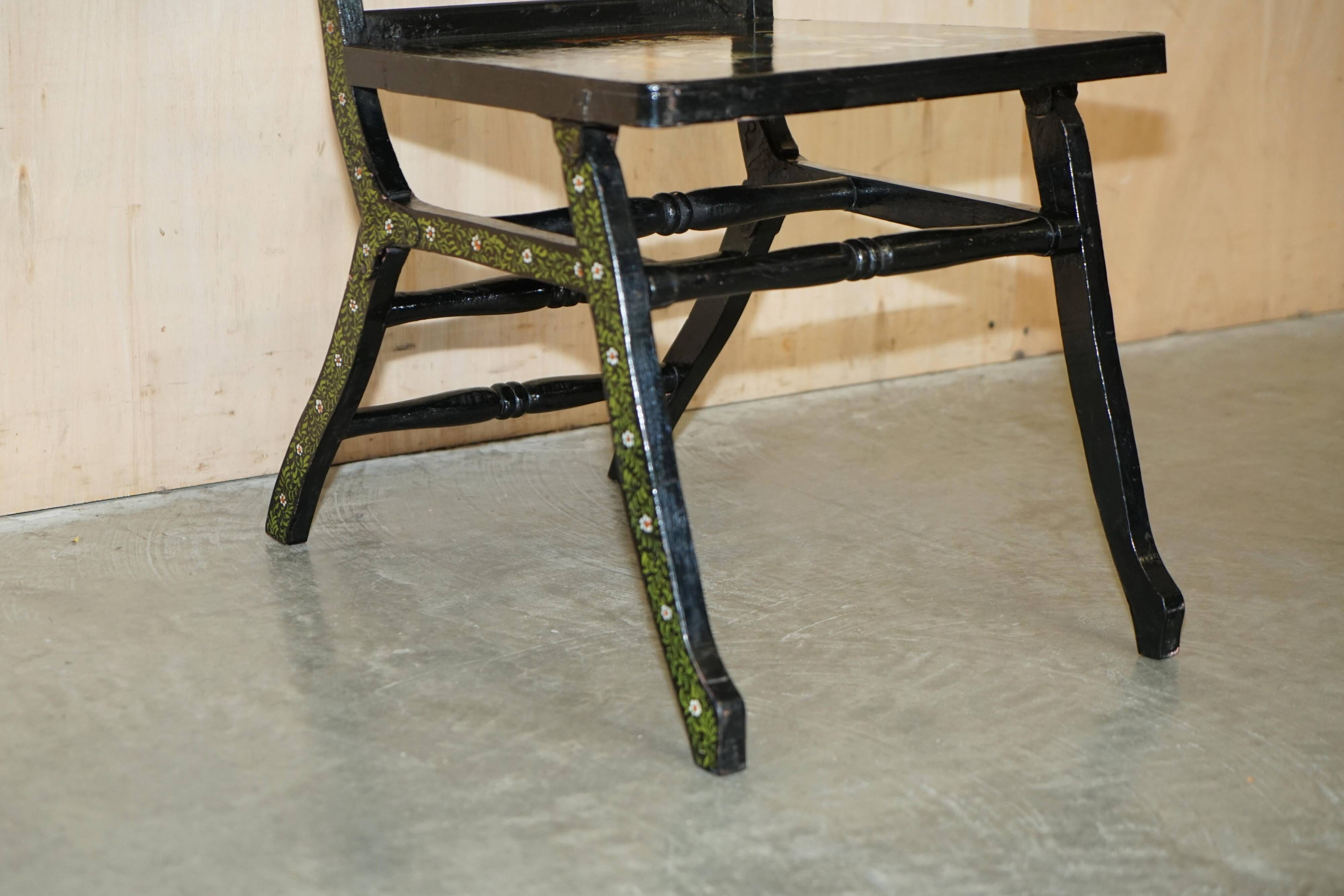 Pair of military folding chairs with Indian decoration.
