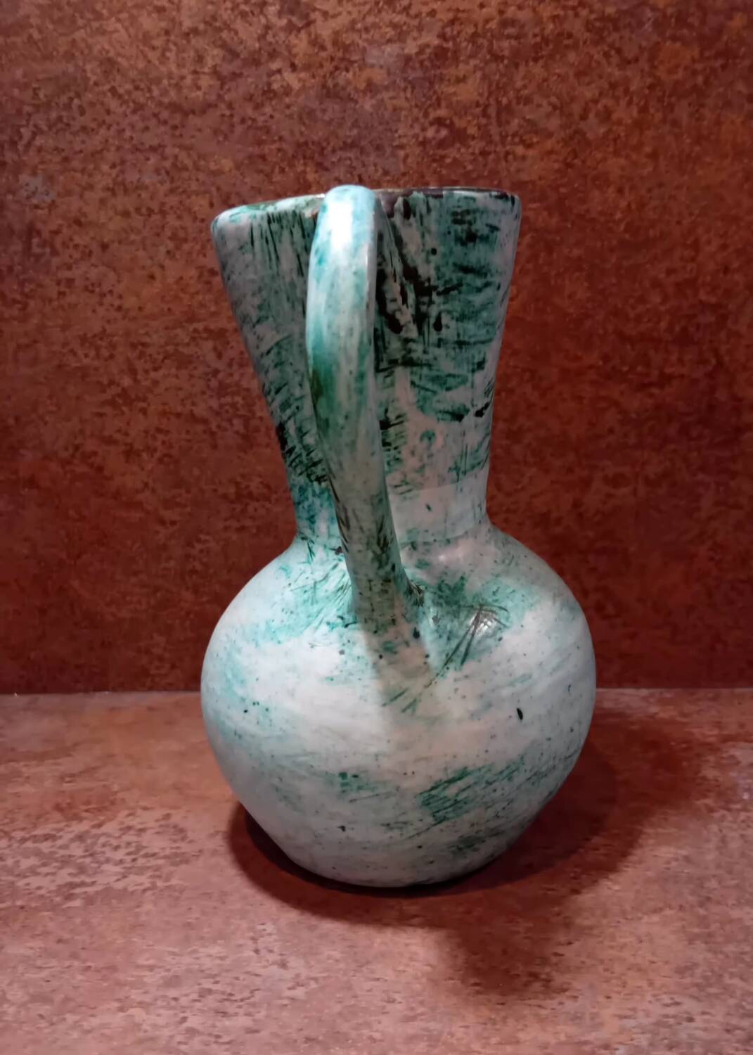 Turquoise ceramic pitcher vase