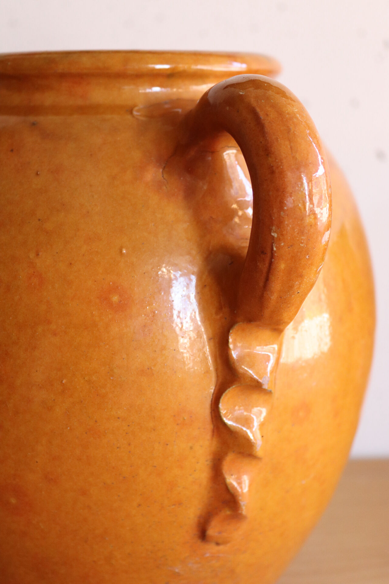 Old honey-glazed pot with two handles