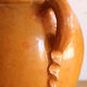 Old honey-glazed pot with two handles