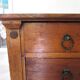 Commode 4 tiroirs en bois massif, début XXème s.