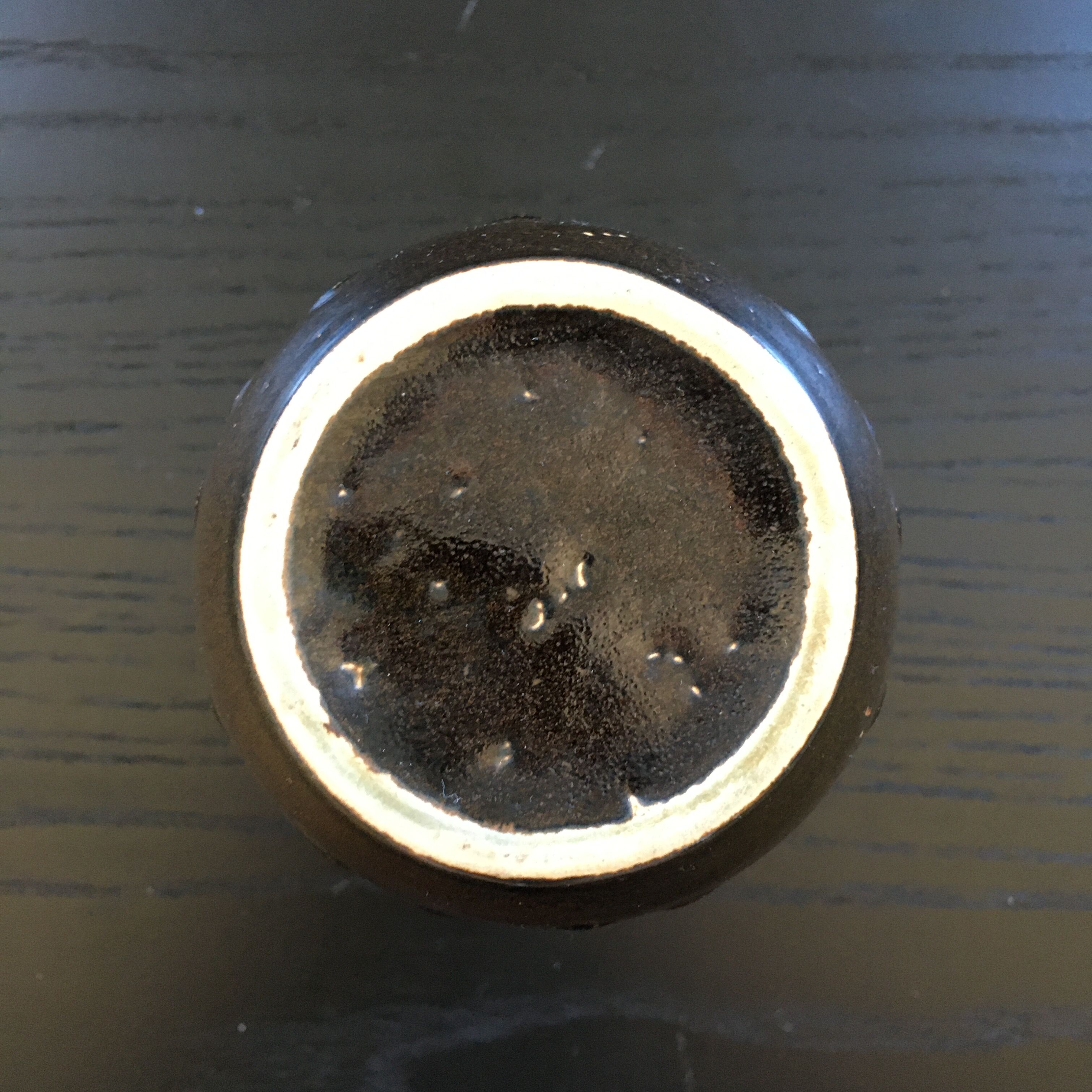 Brown and black flame-colored vase