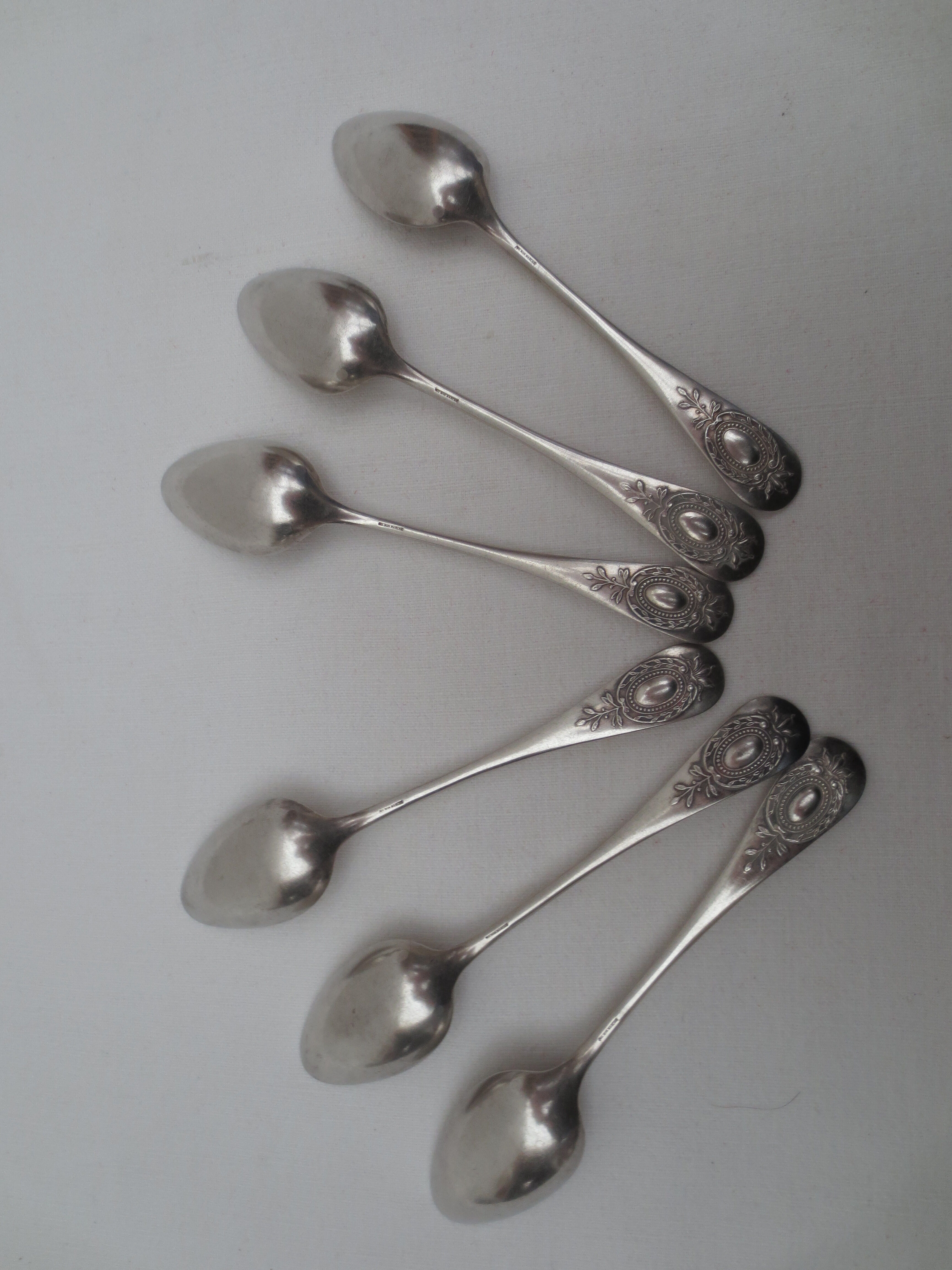 Suite of 6 small silver dessert spoons, medallion decoration
