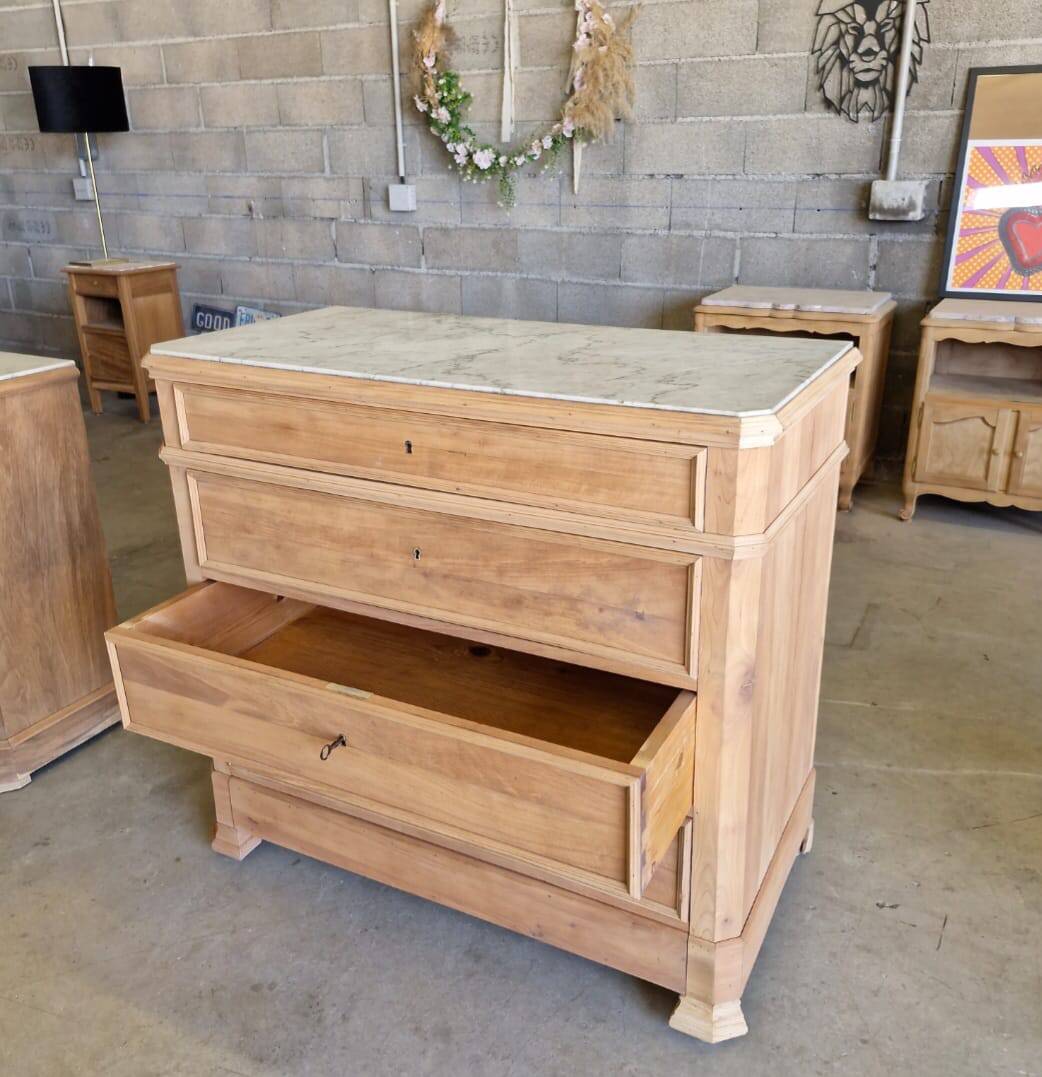 Walnut chest of drawers with white marble.