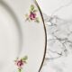 Teacup on its saucer and porcelain cake plate