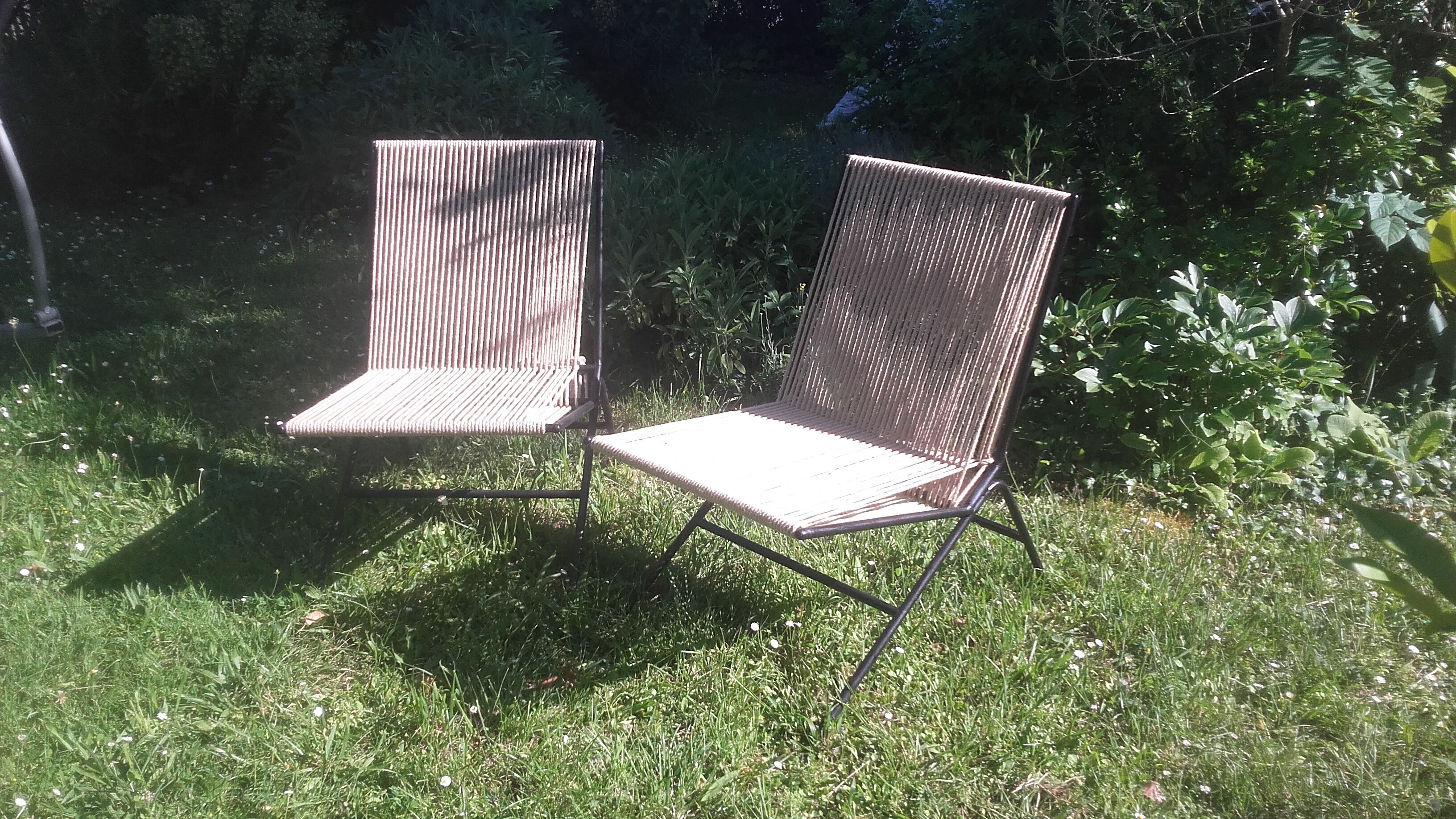 Seated metal and rope backs armchairs