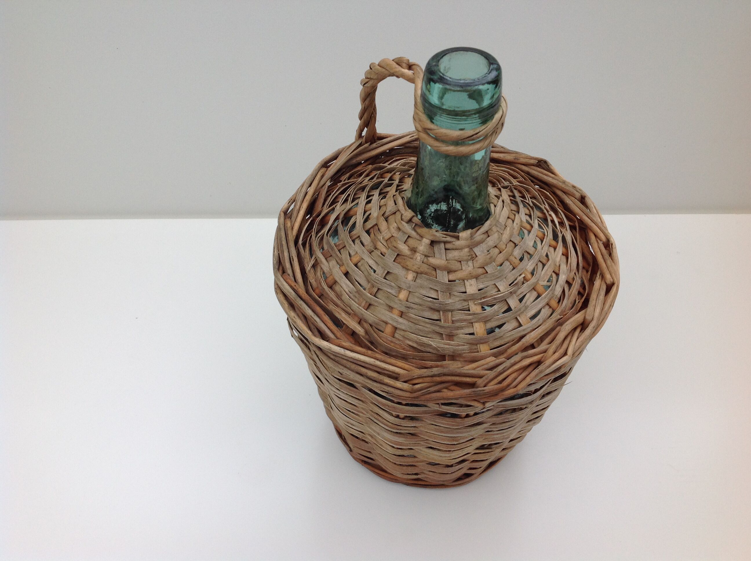 Demojohn surrounded by wicker