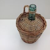 Demojohn surrounded by wicker