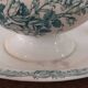 Gravy boat with white and green earthenware handle