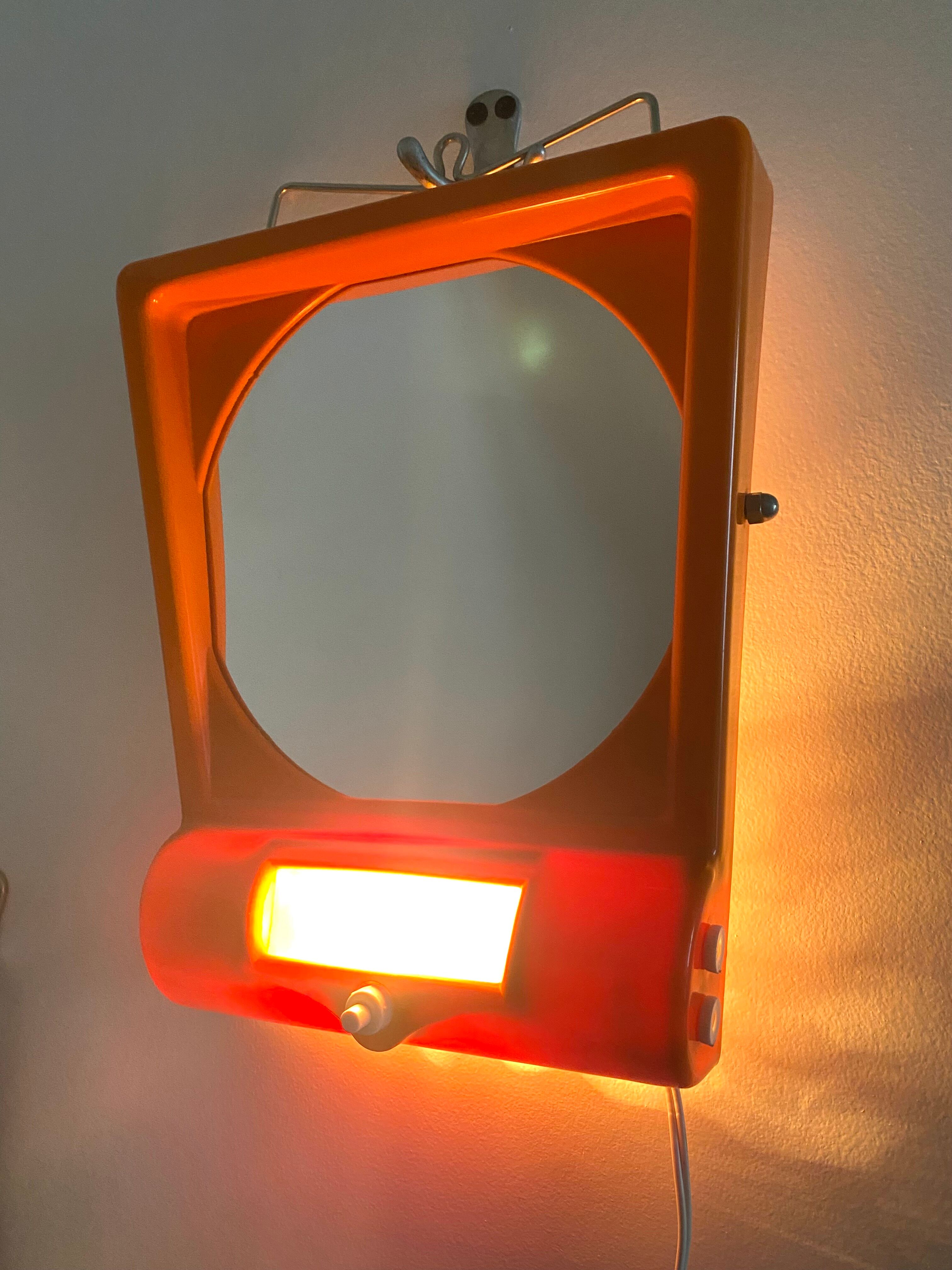 Orange table mirror or magnifying wall with lighting, 70s