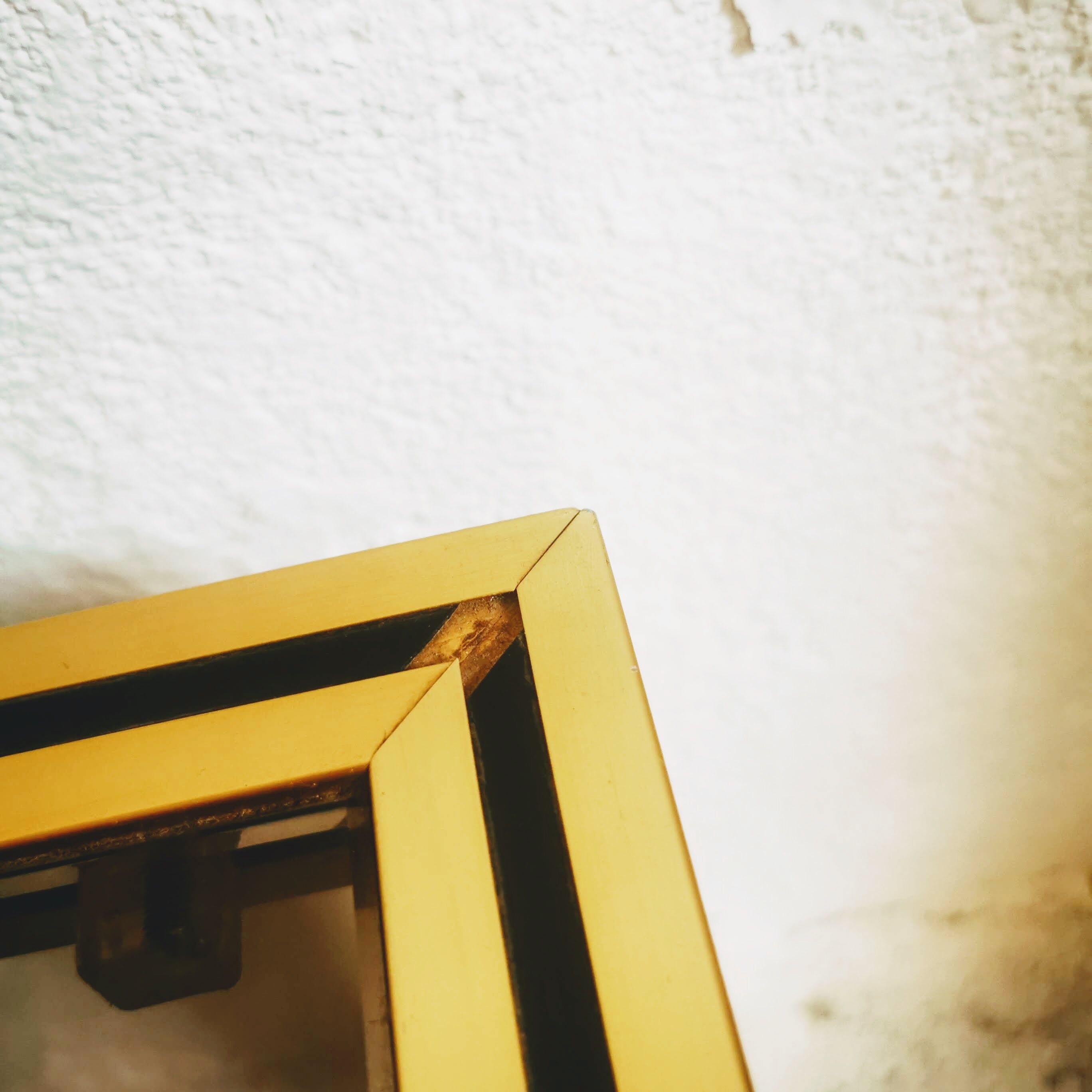 Gold metal side table and smoked glass
