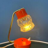 Small orange desk lamp with clear crystal glass shade