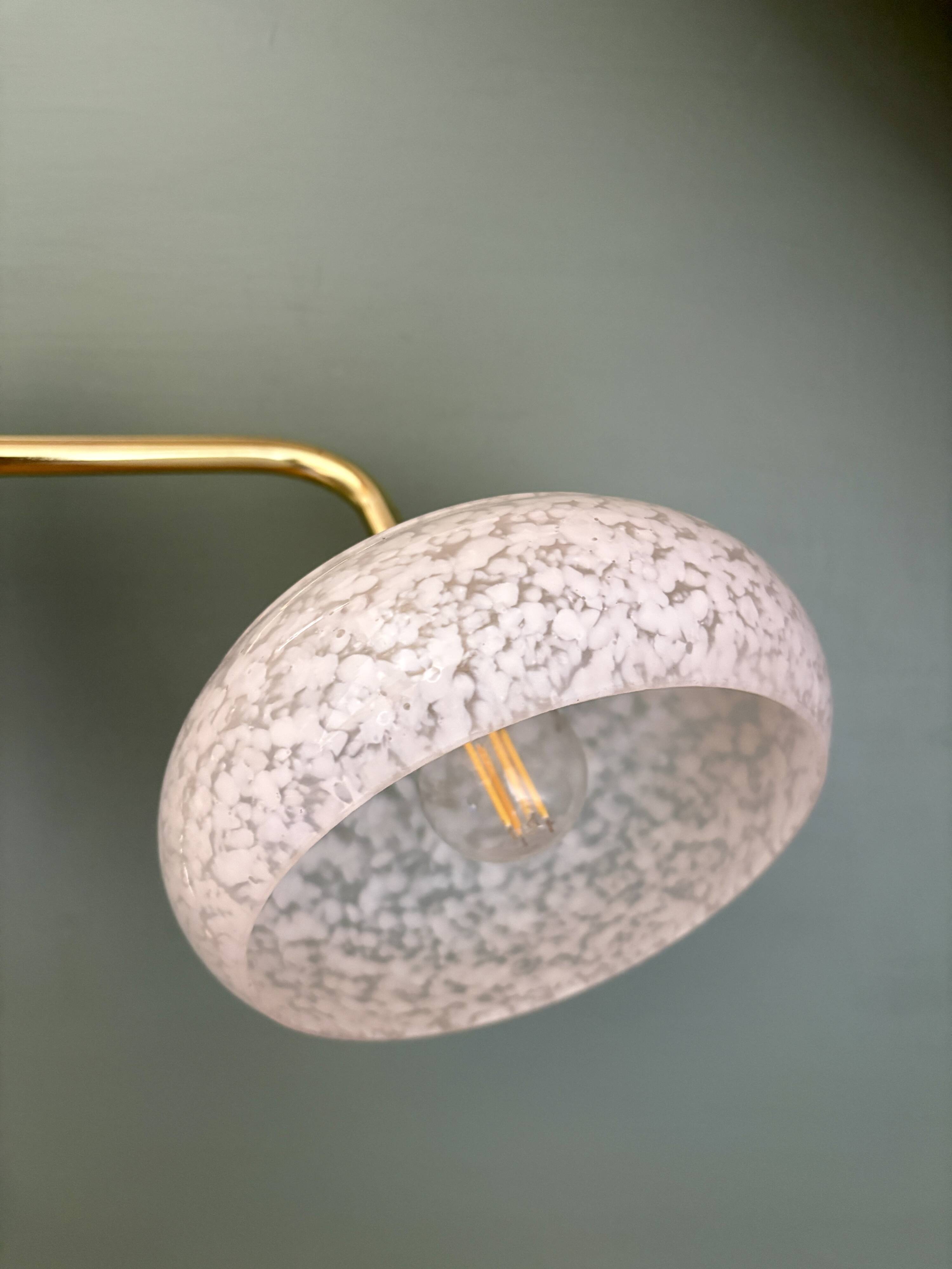 Vintage glass wall lamp with a white Clichy shade.