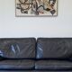 Canapé vintage Roche Bobois – modèle Soleil Noir – cuir noir patiné – 3 places