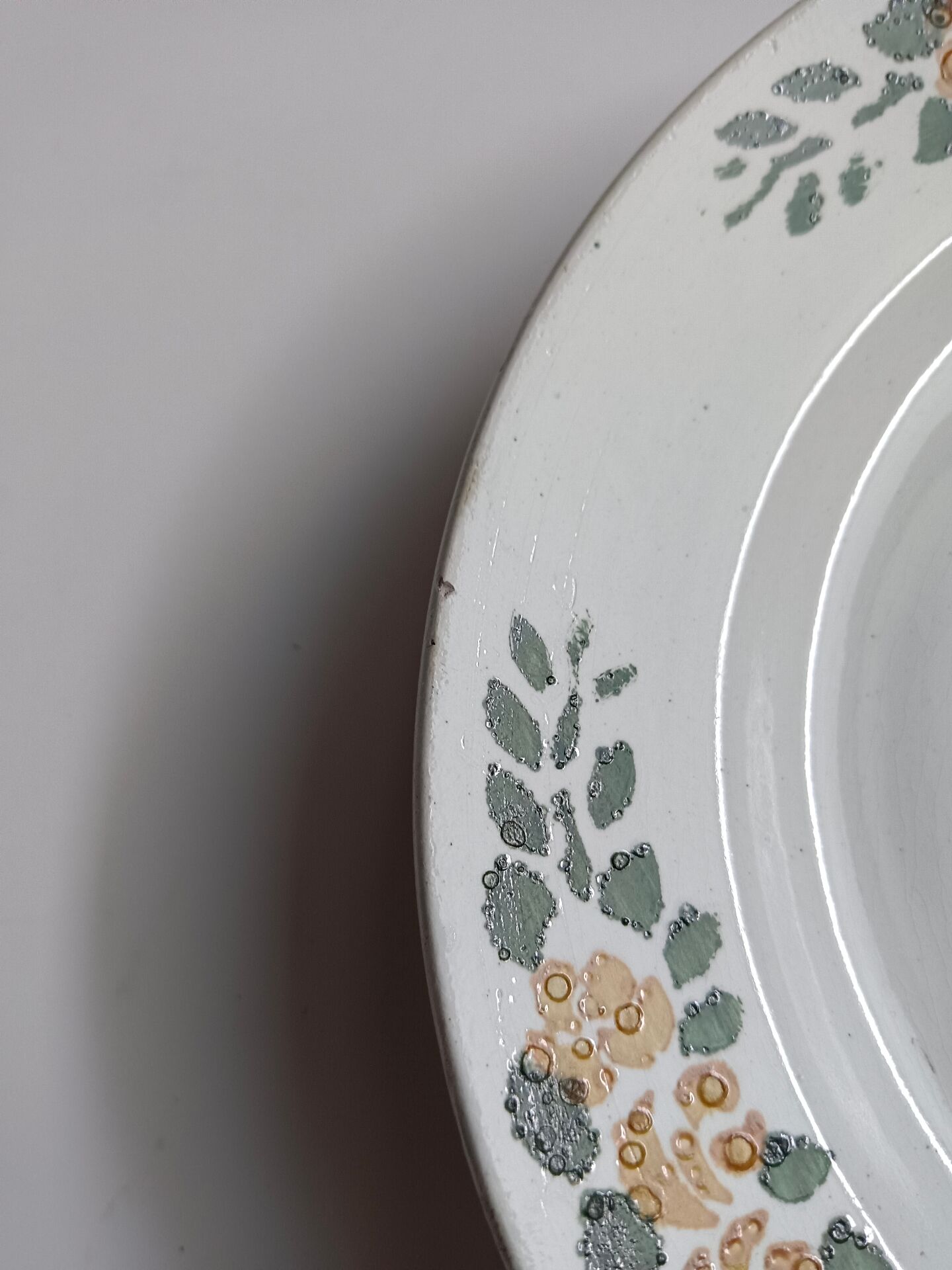 Old round footed plate signed Labrut brothers flowers