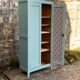 Vintage Parisian wardrobe in grey-blue green.