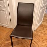 Many brown leather chairs "Roche Bobois"