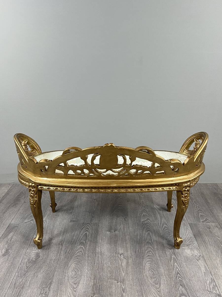 Louis XV style bench in carved and gilded wood, 20th century.