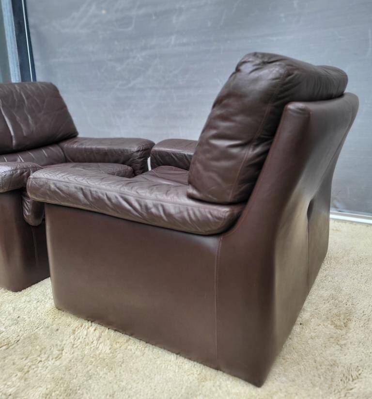 Pair of chocolate leather lounge chairs