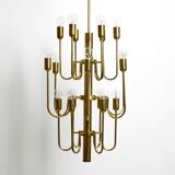 Three staged 18 arm Mid Century brass chandelier with a long brass rod